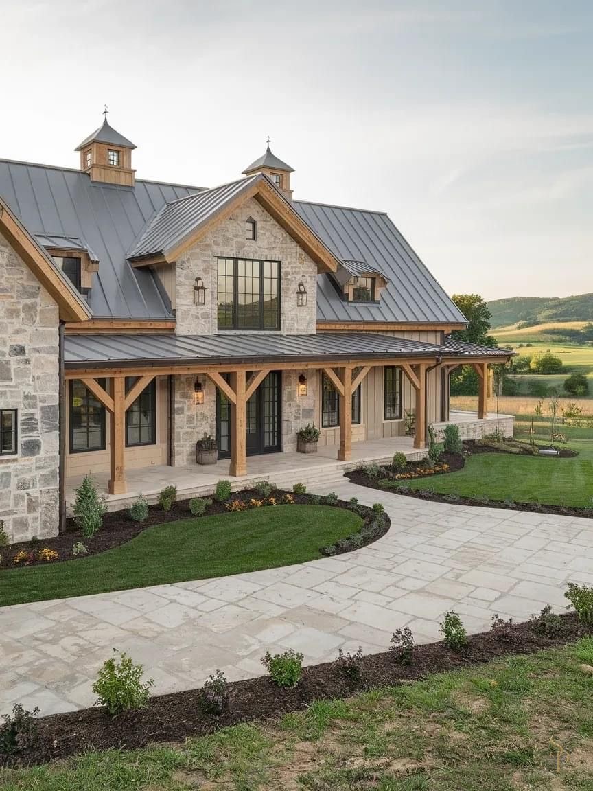 Stone and timber Hill Country farmhouse with standing-seam roof and wrap-around porch